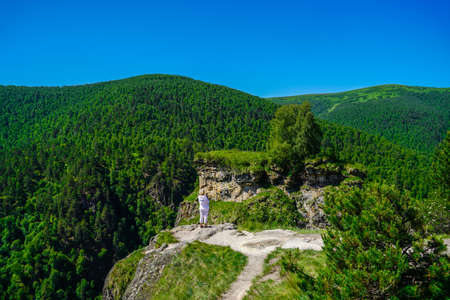Woman take pictures from Forest, Elbrus Regionの写真素材