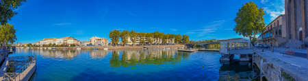Panorama view of Herault river at the town Agde with buildings, Languedoc-Roussillon France
