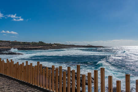 Tropical island of Tenerife. Panorama of the beach on the island of Tenerife. Background blue sky...