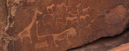 KHORIXAS, NAMIBIA - January 13.2021: Prehistoric Bushman engravings, rock painting at Twyfelfontein, Namibia - Plate with round symbols for waterholes on a rockのeditorial素材