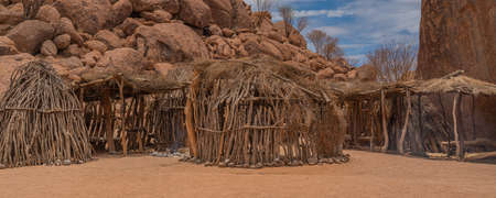 OKAUKUEJO, NAMIBIA - JANUARY 14, 2020: Okaukuejo resort with thatched roof houses and campsite in Etosha National Parkのeditorial素材