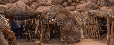 OKAUKUEJO, NAMIBIA - JANUARY 14, 2020: Okaukuejo resort with thatched roof houses and campsite in Etosha National Parkのeditorial素材