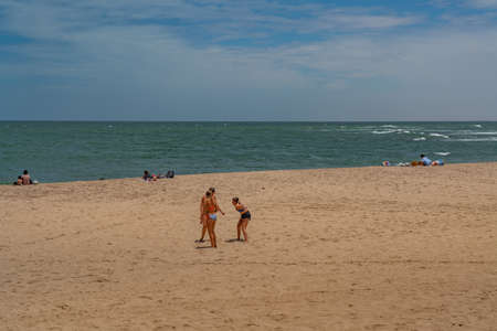 SWAKOPMUND, NAMIBIA - JAN 11, 2020: Promenade in Swakopmund with palm trees and people have rest at the walkingwayのeditorial素材