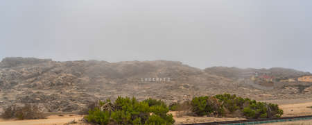 German Kolmanskop - Kolmannskuppe Ghost Town in Namibia with the abandoned buildings in the Namib...