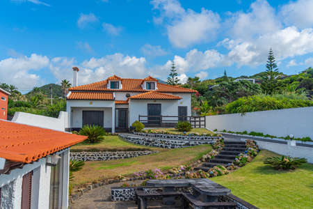 Typical building on Azores island with a beautiful garden with lava stonesのeditorial素材