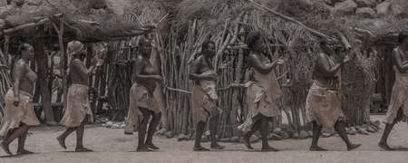 DAMARALAND, NAMIBIA - January 13, 2020: Damara people in traditional clothes demonstrating...