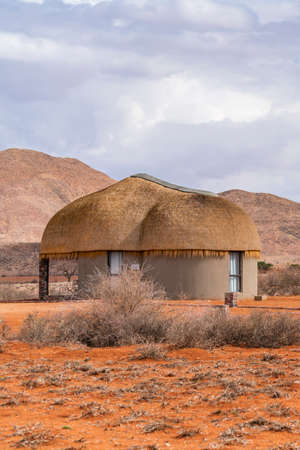 NAMIB NAUKLUFT PARK, NAMIBIA - JANUARY 06. 2021: We Kebi Safari Lodge in Namib-Naukluft National Park close to Sossusvlei with the thatched roof houseのeditorial素材