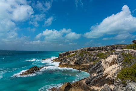 Isla Mujeres South Point Punta Sur Cancun Mexico Island turquoise water and rocky coastline, background blue skyの写真素材