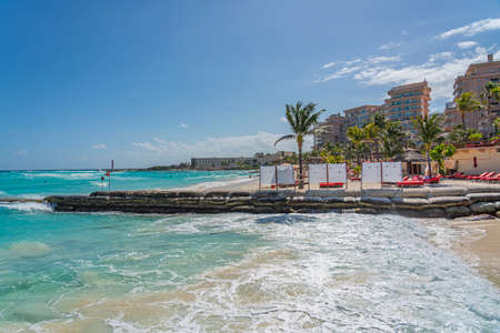 CANCUN, MEXIICO - MARCH 10.2021: The pier of Playa Tortuga - turtle beach with a thatched roof buildingのeditorial素材