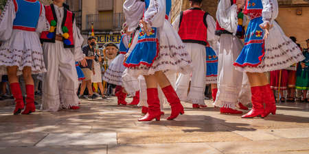 Dancers with red shoes in Ukrainian folk costumes at Montblanc folk festival in Spainのeditorial素材