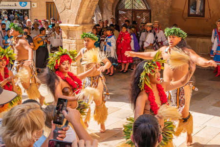 Portrait of attractive young Tahitian male and female dancers in colorful costumes at Montblanc folk festivalのeditorial素材