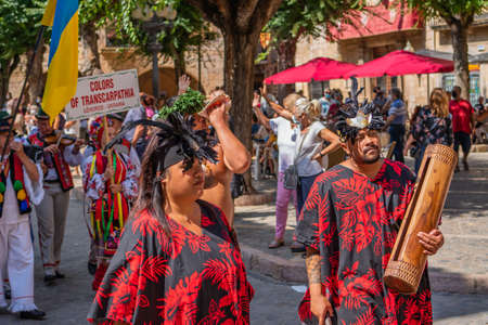 Portrait of attractive young Polynesian Pacific Island Tahitian dancers in colorful costumes at Montblanc folk festivalのeditorial素材