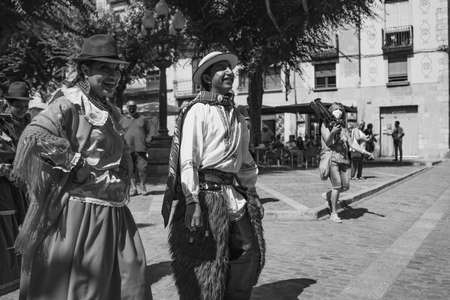 Black and white picture from folk dancers in Ecuador costumes at the folk festival Mayor in Montblanc Spainのeditorial素材