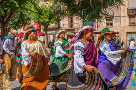 Folk dancers in Ecuador costumes at the folk festival Mayor in Montblanc Spainのeditorial素材