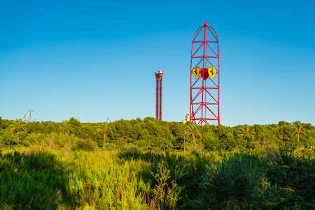 SALOU, SPAIN - SEPTEMBER 19.2021: Amusement Park Port Aventura with the sign Ferrari on a tower