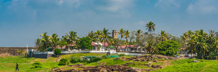 GALLE, SRI LANKA - DECEMBER 24.2021: View of the old colonial fort in Galle, background the clock tower