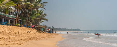 HIKKADUWA, SRI LANKA - JANUARY 22, 2022: Unidentified people on the beach at Hikkaduwa. Narigama surfer beachのeditorial素材