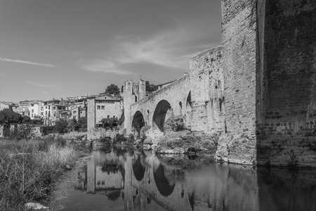 Landscape with the bridge of the medieval village in Besalu in Girona, Catalonia Spain. black whiteのeditorial素材