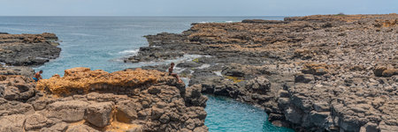 SAL ISLAND, CAPE VERDE - JUNE 22.2022: Buracona - The Blue Eye of Cabo Verde, a boy at the rocks
