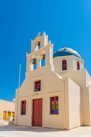 Church in Oia on Santorini island, Greece, verticalの写真素材