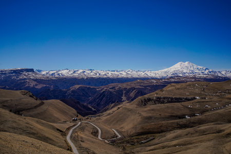 Panorama of Mount Elbrus against the backdrop of the Main Caucasian Range. Karachay-Cherkessia....
