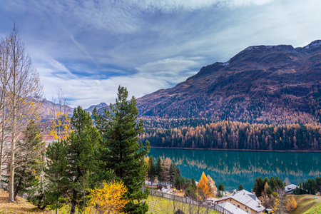 St. Moritz with Lake St. Moritz in autumn colors in Engadine, Switzerland, background the mountains