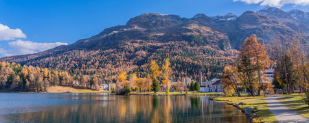 Panorama view over the St. Moritz lake in St. Moritz in autumn colors in Engadine, background the mountainsの写真素材
