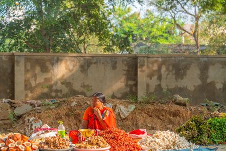 A women selling red chili peper on the local Indian marketのeditorial素材