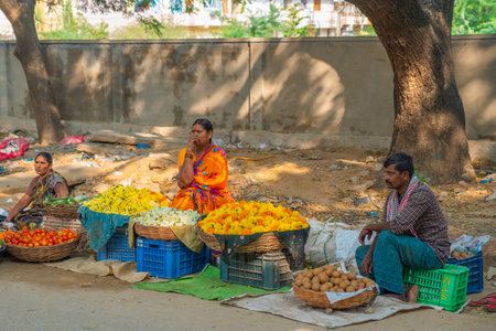 A women selling flowers on a local Indian marketのeditorial素材