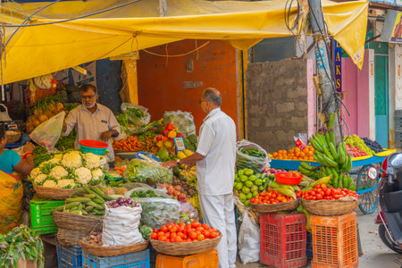 A man selling vegetables at a shop in India