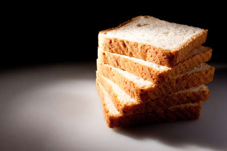 White bread slices all stacked artistic studio light schemeの写真素材
