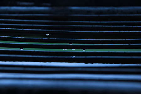 Drop of water on ironの写真素材