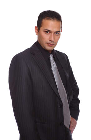 Serious Businessman posing for the camera isolated on whiteの写真素材