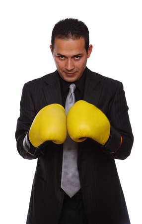 Businessman wearing boxing gloves isolated on whiteの写真素材