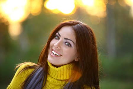 Beautiful girl looking at the camera in nature