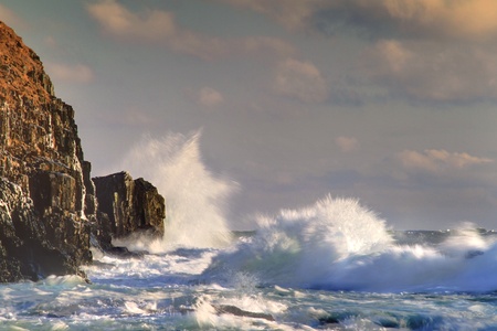 Waves breaking on the rocks near the shore.の写真素材