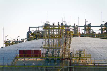 Top of an Oil and Gas Storage Tank with vents and stairs.の写真素材