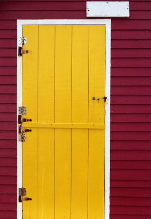 Brightly colored wooden door and wallの写真素材