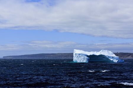Iceberg slowly melting in Conception Bay, Newfoundland, Canadaの写真素材