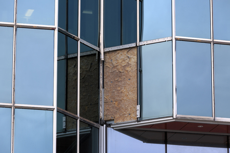 Broken glass in a modern office buildingの写真素材