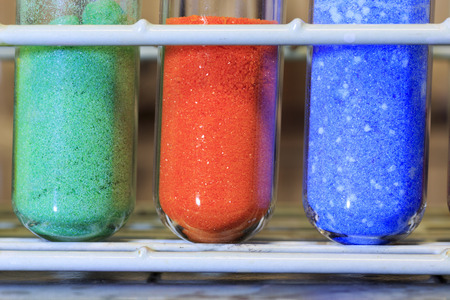 Different colored inorganic chemical salts used in a chemistry lab.の写真素材
