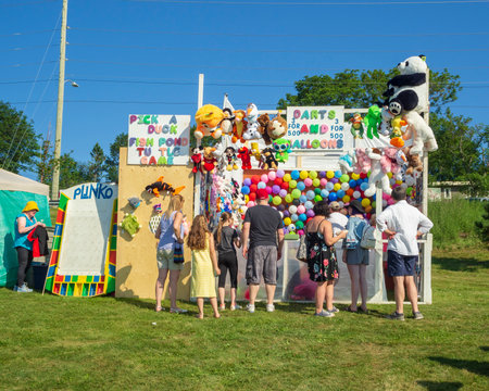 ST. JOHNâS, CANADA, AUGUST 1, 2018: Games of chance entertain fans between boat races at the 200th running of the Royal St. Johnâs Regatta, taken on August 1 in St. Johnâs.のeditorial素材