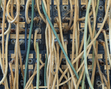 Vintage communication cables and connectors from the early 20th century.