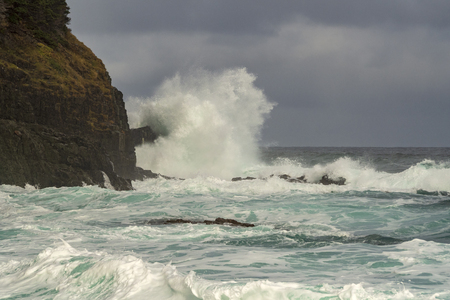 Huge waves crashing on the rocks at Middle Cove Beach, St. Johnâs, Newfoundland and Labrador, Canada.の写真素材