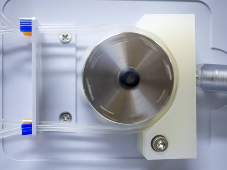 Peristaltic pump with plastic tubes. With rollers moving.