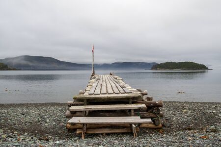 An old fishing wharf at low tide, Trinity Bay, Newfoundland and LAbrador, Canada.の写真素材