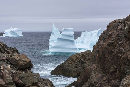 An iceberg along the Newfoundland coastline in summer, very popular with tourist.の写真素材