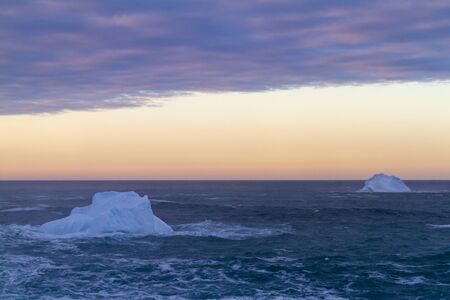 An iceberg along the Newfoundland coastline in summer, very popular with tourist.の写真素材