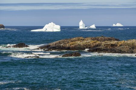 An iceberg along the Newfoundland coastline in summer, very popular with tourist.の写真素材