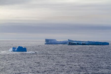 An iceberg along the Newfoundland coastline in summer, very popular with tourist.